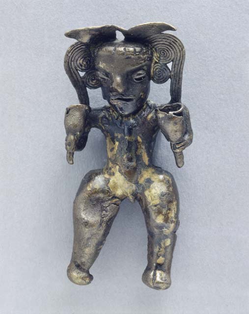 Golden human figure pendant